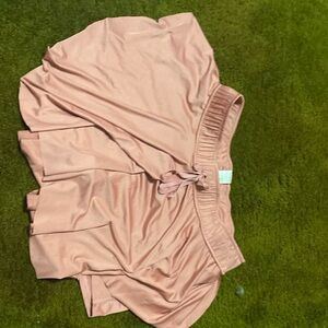 New in pink skirt with shorts under.
